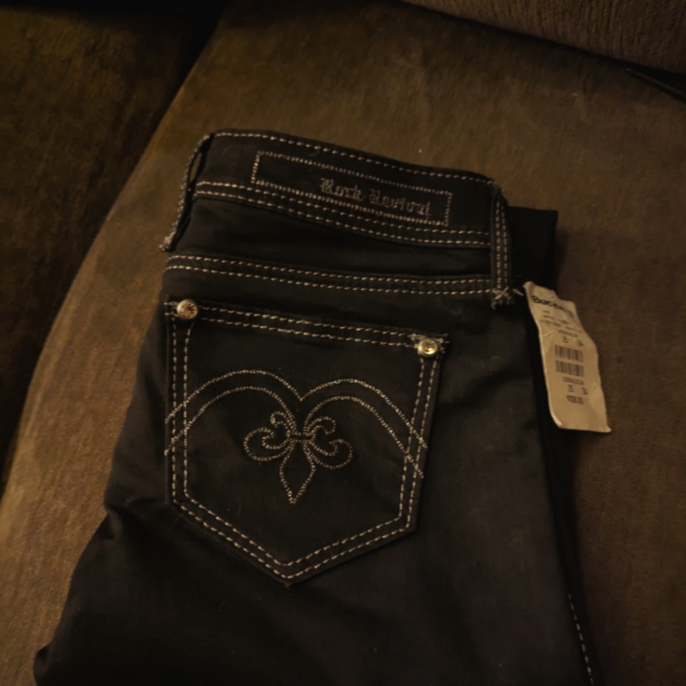 New with tags size 25x32 Rock Revival black straight leg pants. Never worn.